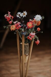 Steam bent rustic vase with beautiful flowers